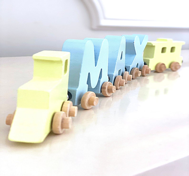 Build your own Train in custom colors of Baby Blue and Yellow. Personalized Wooden Magnetic Alphabet Letters. Engine and Wagon Included.