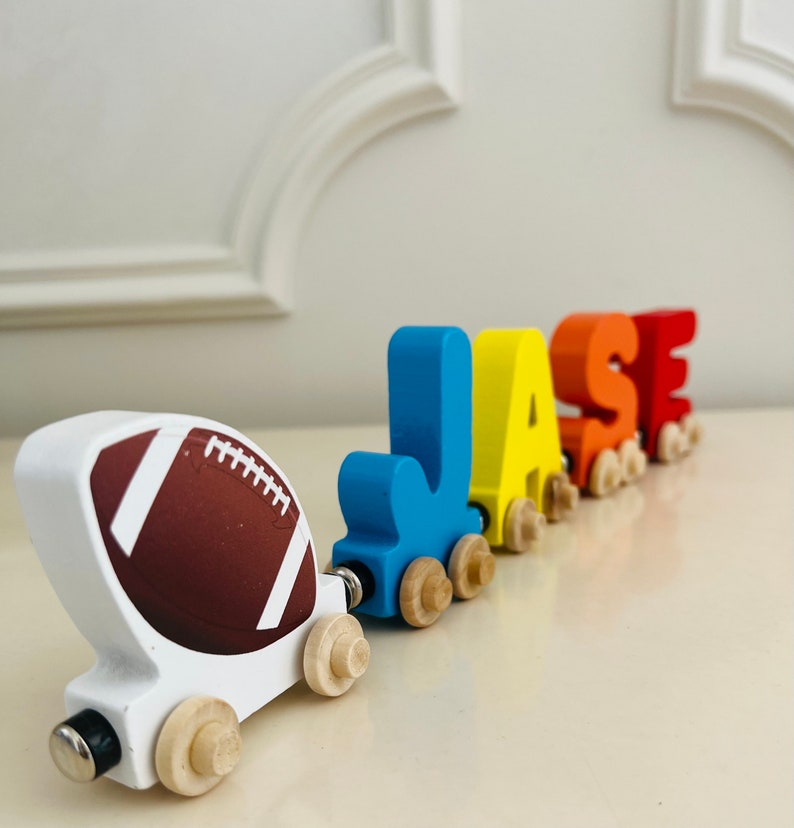 Build your own Train with a Football Sport Theme. Personalized Wooden Magnetic Alphabet Letters. Kids Toy and Room display. Name puzzle.