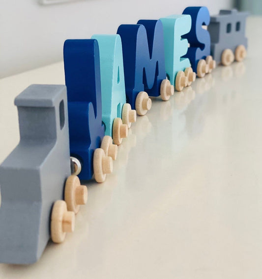 Build your own Train in Mint and Navy letters. Personalized Wooden Magnetic Alphabet Letters. Engine and Wagon Included. Name puzzle.
