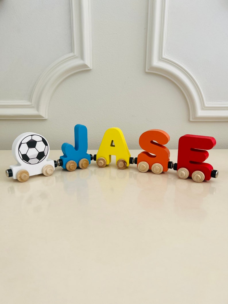 Build your own Train with a Soccer Ball Sport Theme. Personalized Wooden Magnetic Alphabet Letters. Kids Toy and Room display. Name puzzle.