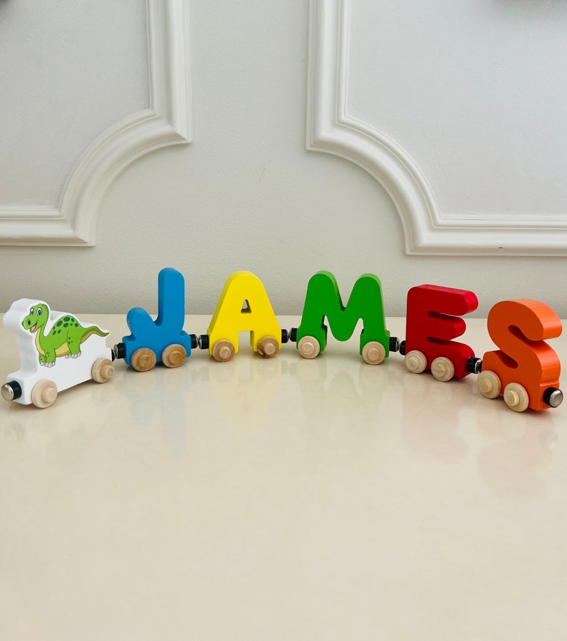 Build your own Train with a Green Dinosaur. Personalized Wooden Magnetic Alphabet Letters. Kids Toy and Room display. Name puzzle.