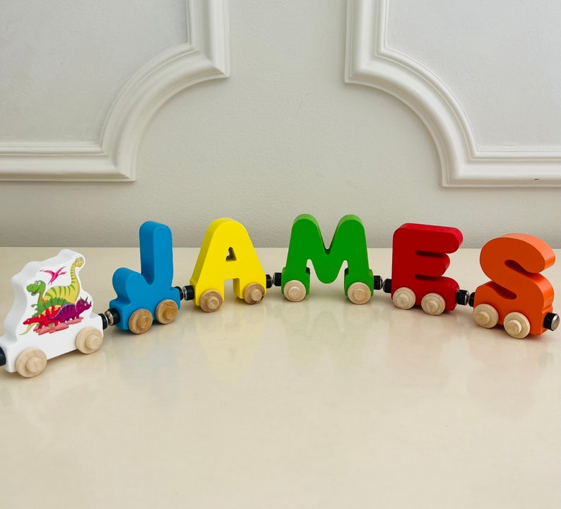 Build your own Train with a Dinosaur theme. Personalized Wooden Magnetic Alphabet Letters. Kids Toy and Room display. Name puzzle.